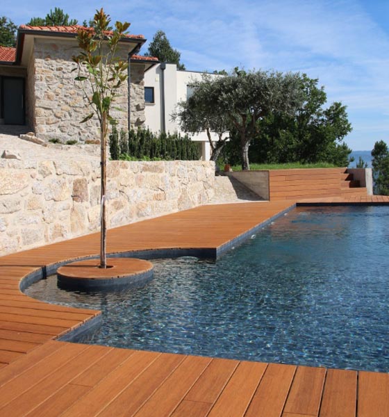 Luxury bamboo deck beside an infinity pool